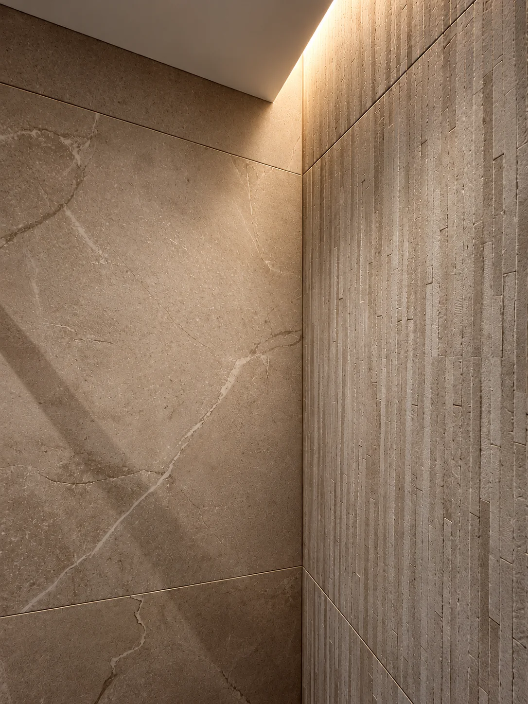 Détail de la douche du projet Demours, pierre grise veinée et éclairage discret.